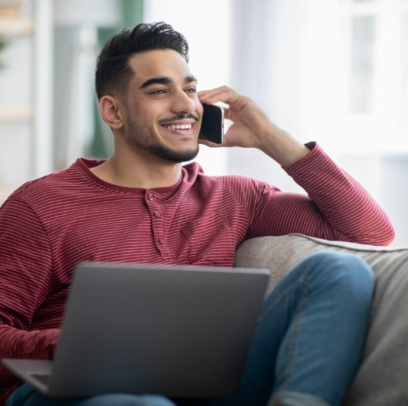 middle-eastern-man-working-online-using-laptop-and-KCZRAXN-e1627785630402.jpg